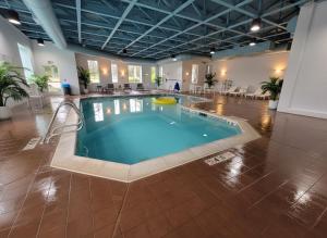 a large swimming pool in a large building at Clarion Inn Idaho Falls Riverfront in Idaho Falls