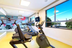 a gym with cardio equipment and a window at Nacional Inn Palmas in Palmas +24 photos