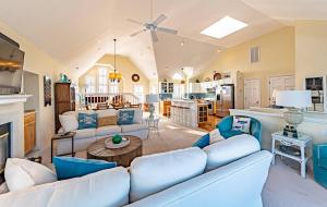 a living room with a couch and a table at Point of View in Nags Head