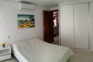 Giường trong phòng chung tại Flat Club Meridional Carneiros +33 ảnh