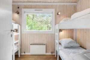 a bedroom with two bunk beds and a window at TV1598-Jerup-Kippen-32 in Jerup +21 photos