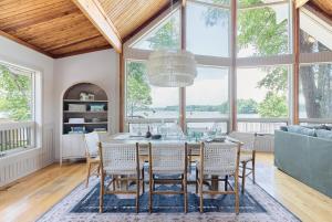 a dining room with a table and chairs at Unique LKN Waterfront Home with Dock in Mooresville