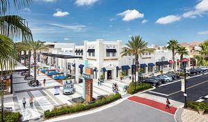 an artist rendering of the proposed development at the intersection of a street at Charming 3BR Townhome. in Deerwood Club