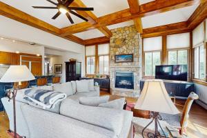 a living room with a couch and a fireplace at Palmyra 4A - Panoramic Peaks Lodge in Telluride