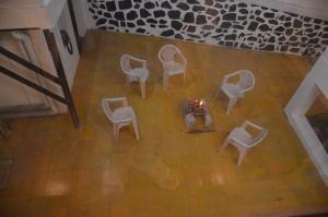 an overhead view of a group of chairs and a fire at ARYASREE homestay in Kodaikānāl