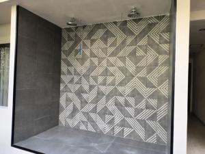 a shower with a tiled wall in a bathroom at Tulum City Apartments Bakal C in Tulum +22 photos