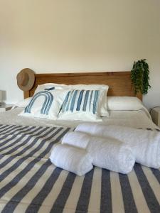 a bed with two white pillows on top of it at Apartamento moderno con encanto in Los Realejos
