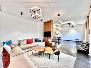 a living room with a couch and a table at Villa Elia Luxury Oasis in Marrakech