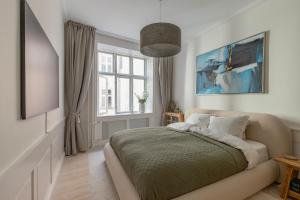 Ένα ή περισσότερα κρεβάτια σε δωμάτιο στο Modern Central