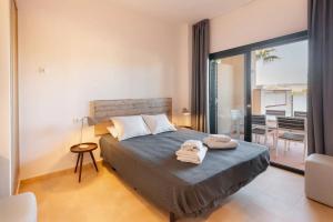 Postel nebo postele na pokoji v ubytování Casita Palmera- Malasia 44 Precioso y Tranquilo Apartamento en Hacienda del Alamo + 12 fotografií