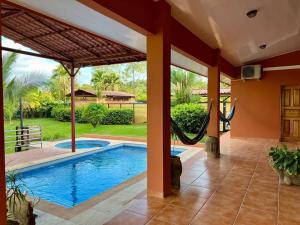 an image of a swimming pool in a house at Finca Terra, Private Country Home, Mountain Views and Pool in Naranjito