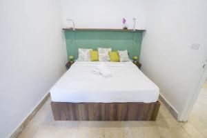 a small bedroom with a bed in a room at Spirit - 2-BR Apt & Balcony in Mar Mikhael in Al Mudawwar