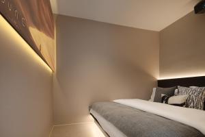 Postel nebo postele na pokoji v ubytování 成都s恩季酒店春熙路太古里店