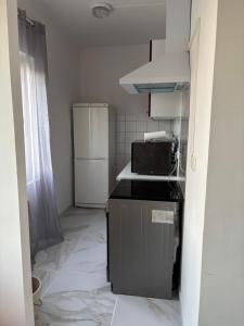 Η κουζίνα ή μικρή κουζίνα στο T2 4 couchages 15 minutes de valras plage 5 minutes du centre beziers +4 φωτογραφίες