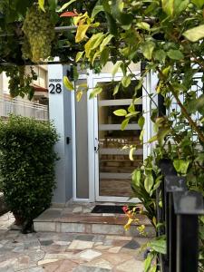 a front door of a house with the on it at L28 apartment in Tripoli