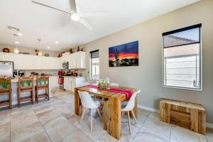 a kitchen and dining room with a table and chairs at San Tan Valley Vacation Rental with Community Perks! in San Tan Valley