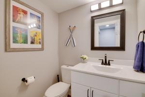 a bathroom with a white toilet and a sink at Kimberling City Getaway Fish and Boat Nearby! in Kimberling City +19 photos