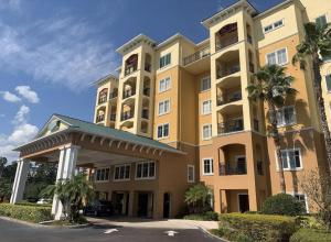 a large apartment building with a gazebo in front of it at Resort Lake Buena Vista - 2 Quartos in Vineland
