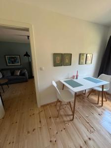 a living room with a table and chairs at Rosa,s Garten in Schlieben