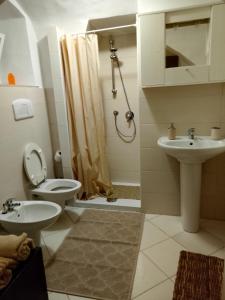 a bathroom with a toilet and a sink and a shower at ARCO in Bisceglie +26 photos