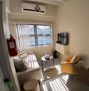 Televisyen dan/atau pusat hiburan di Atrium Apartments - Nutmeg Nook