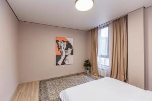 a bedroom with a bed and a large window at City Villa in Koktobe +230 photos