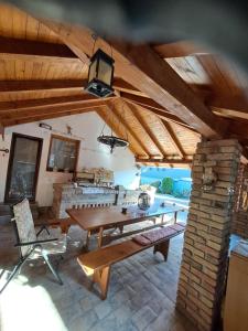 a dining room with a wooden table and chairs at Lavanda in Vukovar