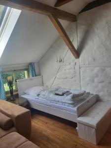 a bedroom with a bed in a attic at Ferienwohnung Siegglück in Mittelhof