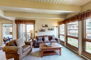 a living room with a couch and a coffee table at The Lodge at Steamboat in Steamboat Springs