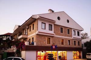 a building with a store in front of it at Mesude Hanim "Yaprak Piren" in Datca