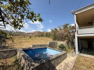 a swimming pool in the backyard of a house at Family cozy House in Berd in Berd