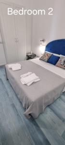 a bedroom with a bed with two towels on it at Cielo e Mare in Positano +45 photos