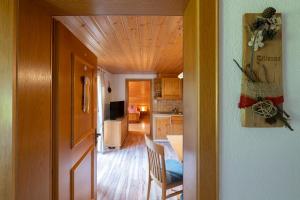 a room with a kitchen and a dining room at Haus Hubertus in Schruns-Tschagguns +2 photos