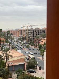 a view of a city street with cars and buildings at Luxury Apartment in Majorelle Downtown of Marrakech Wi-Fi AC Calm in Marrakech