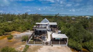 an aerial view of a house with a beach at Casa Sirena Belize! Studio 2 in Caye Caulker