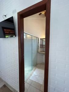 Et tv og/eller underholdning på Pousada Jardim das Bromélias