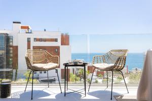 two chairs and a table on a balcony at Mara's Apartments Higuerón - Azzurro Med Two Collection - Seaviews in Fuengirola