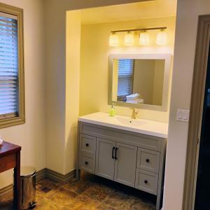 a bathroom with a sink and a mirror at 6 Olivia Lane in Deer Lake +32 photos