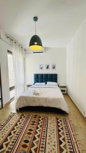 Krevet ili kreveti u jedinici u okviru objekta Loom & Light In the best location in Abdoun Amman