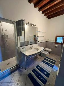 a bathroom with a shower and a sink at Historic Villa Among Olive Groves In Arezzo in San Polo