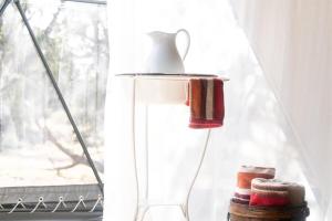 a vase with a tea kettle on a window sill at Private Dome Getaway - 30min to Grand Canyon in Valle +18 photos