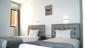 Postel nebo postele na pokoji v ubytování Hotel Nouzha + 206 fotografií