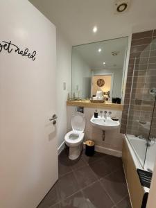 a bathroom with a toilet and a sink at The View in Sunderland