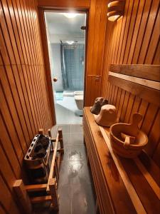 a kitchen with a stove and a sink in a room at Appartamento con sauna e home cinema in Colonno