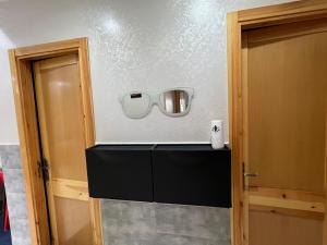 a room with a counter and a mirror on the wall at Spacious 3BR Apartment Near Akdital in Fès
