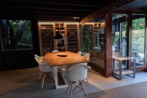 a dining room with a wooden table and chairs at Casa da Horta in Peso da Régua