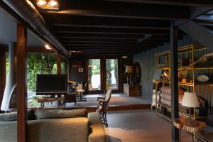 a living room with a couch and a tv at Casa da Horta in Peso da Régua