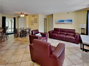 a living room with a couch and chairs and a table at Put-in-Bay Poolview Condo #3 in Put-in-Bay