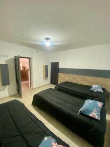 Ένα ή περισσότερα κρεβάτια σε δωμάτιο στο Hostel San Miguel