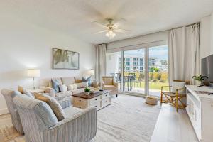 a living room with a couch and a table at High Pointe 133 in Seacrest